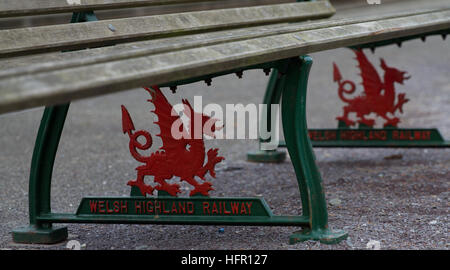 Welsh Highland Railway, WHR, Dinas station - Welsh Dragon emblems cast into the seat bases and painted with the railway name Stock Photo