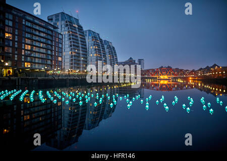 Manchester Salford Quays docks basin show   Voyage by Aether & Hemera features a total of 198 origami boats which will float on the water in Dock 9. T Stock Photo