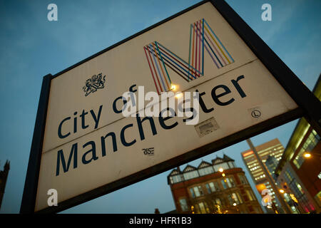 City of Manchester welcome sign   Council M logo metal road side notice welcome to M logo city of Manchester sign street Peter Saville design M travel Stock Photo