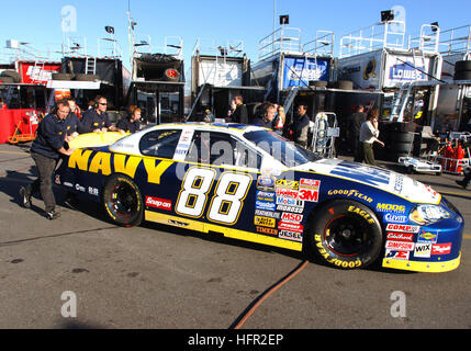 060215-N-5862D-108 Daytona, Fla. (Feb. 15, 2006) Ð Members of JR Motorsports push the No. 88 Navy ÒAccelerate Your LifeÓ Chevrolet Monte Carlo to pit row before practice at the Daytona International Speedway. Mark McFarland was at the wheel for the 2006 NASCAR Busch Series season driving the U.S. Navy sponsored car that is owned by Dale Earnhardt Jr., which made itÕs debut at the HersheyÕs Kissable 300. U.S. Navy photo by Chief Photographer's Mate Chris Desmond (RELEASED) US Navy 060215-N-5862D-108 Members of JR Motorsports push the No. 88 Navy Chevrolet Monte Carlo to pit row before practice  Stock Photo