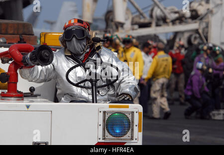 A sailor in training to handle a U.S. Navy PT torpedo boat mans one of ...