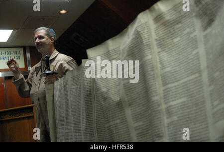 081006-N-4005H-097 GULF OF OMAN (October 06, 2008) Cmdr. Joel Newman, a Rabbi aboard the Nimitz-class aircraft carrier USS Ronald Reagan (CVN 76), explains the Torah in the ships chapel during an introduction class to the Jewish religious holiday of Yom Kippur before a brief Yom Kippur service. The Torah, which was donated to the ship, was hand written about 200 years ago. Ronald Reagan is deployed to the U.S. 5th Fleet area of responsibility. U.S. Navy photo by Mass Communication Specialist 3rd Class Aaron Holt/Released) US Navy 081006-N-4005H-097 Cmdr. Joel Newman, a Rabbi aboard the Nimitz- Stock Photo