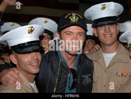 060524-N-7365V-109  New York Harbor (May 24, 2006) - In the hangar bay aboard the amphibious assault ship USS Kearsarge, actor Hugh Jackman, poses for pictures with Marines assigned to the 10th Marine Division. Jackman who plays Logan, AKA ÒWolverineÓ in the 20th Century Fox upcoming action, sci-fi, ÒX-Men: The Last Stand,Ó visited with Sailors and embarked Marines during the opening day of Fleet Week New York 2006.  The crew was also given a special sneak preview of the film before its worldwide release date of May 26, 2006. Fleet Week has been sponsored by New York City since 1984 in celebra Stock Photo