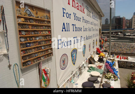 060525-N-4936C-008 New York (May 25, 2006) A memorial at the  World Trade Center Ground Zero site displays policemen, firemen and military mementos from around the world. Many items included are hats, patches, unit coins and various other items honoring those who lost their lives September 11, 2001. Many Sailors and Marines participating in Fleet Week New York City will visit this site during Fleet Week May 24-May 30 2006. Fleet Week is New Yorkís celebration of the sea services honoring those who have made the ultimate sacrifice through numerous Memorial Day events, remembrances and services. Stock Photo