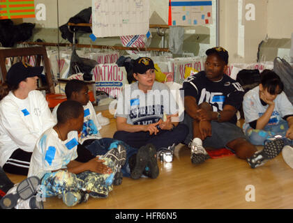 Sailors from USS Kearsarge, students, and non-profit personnel collaborate on a community relations painting project at Brooklyn Intermediate School #291 during Fleet Week 2006. Stock Photo