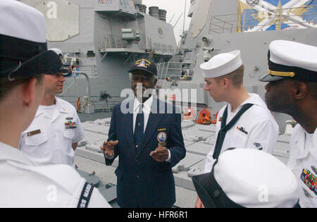 060526-N-4936C-003 New York (May 26, 2006) - Lorenzo Dufau, part of the crew of the first USS Mason (DE-59), talks to Sailors aboard the current USS Mason (DDG 87) in New York City during Fleet Week New York 2006. Mr. Dufau was a member of the USS Mason during World War II, which was the first naval ship predominantly manned by black crew members. The crew of the current USS Mason (DDG 87) honored Mr. Dufau on the ship while she participated in Fleet Week New York. Fleet Week is New YorkÕs celebration of the sea services honoring those who have made the ultimate sacrifice through numerous Memo Stock Photo