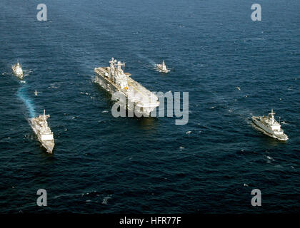 060604-N-2651J-257 Mediterranean Sea (June 4, 2006) - The five ships participating in exercise Phoenix Express 2006, amphibious assault Ship USS Saipan (LHA 2), guided-missile frigate USS Simpson (FFG 56), Armada Espanola Infanta Elena (P-6), Royal Moroccan Navy Frigate Mohammed V (611), and Algerian Naval Forces El Kirch (353) sail in formation in the Mediterranean Sea. Exercise Phoenix Express will provide U.S. and allied forces an opportunity to participate in diverse maritime training scenarios helping to increase maritime domain awareness and strengthen emerging and enduring partnerships. Stock Photo