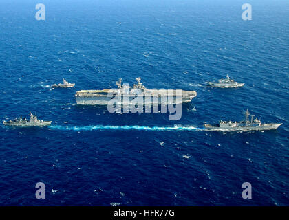 060604-N-2651J-262 Mediterranean Sea (June 4, 2006) - The five ships participating in exercise Phoenix Express 2006, amphibious assault Ship USS Saipan (LHA 2), guided-missile frigate USS Simpson (FFG 56), Armada Espanola Infanta Elena (P-6), Royal Moroccan Navy Frigate Mohammed V (611), and Algerian Naval Forces El Kirch (353) sail in formation in the Mediterranean Sea. Exercise Phoenix Express will provide U.S. and allied forces an opportunity to participate in diverse maritime training scenarios helping to increase maritime domain awareness and strengthen emerging and enduring partnerships. Stock Photo