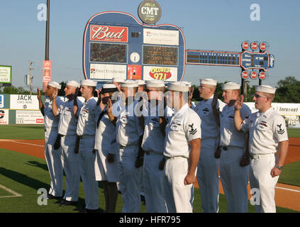 060605-N-2908O-004 Nashville, Tenn. (June 5, 2006) Ð Crew members assigned to the Ohio-class submarine USS Tennessee (SSBN 734) and Navy Recruiting District Nashville raise their right hands and take the oath of enlistment at a Nashville Sounds Baseball game as part of Navy Week Nashville. Twenty such Weeks are planned this year in cities throughout the U.S., arranged by the Navy Office of Community Outreach (NAVCO). NAVCO is a new unit tasked with enhancing the Navy's brand image in areas with limited exposure to the Navy. U.S. Navy photo By Journalist 1st Class Steve Owsley (RELEASED) US Nav Stock Photo