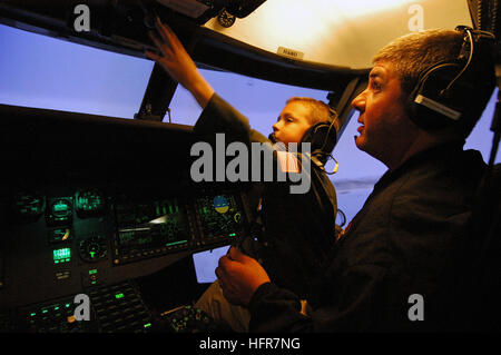 071004-N-2183K-212 CORONADO, Calif. (Oct. 4, 2007) - Father and son, fly an MH-60S Seahawk helicopter in a flight simulator at Helicopter Sea Combat Squadron (HSC) 23, on board Naval Air Station North Island. The six year-old fulfilled his wish to fly aboard a military helicopter with the help of HSC-23 and the Make-A-Wish Foundation, which works with terminally ill children. U.S. Navy photo by Mass Communication Specialist 3rd Class Dustin Kelling (RELEASED) US Navy 071004-N-2183K-212 Father and son, fly an MH-60S Seahawk helicopter in a flight simulator at Helicopter Sea Combat Squadron (HSC Stock Photo