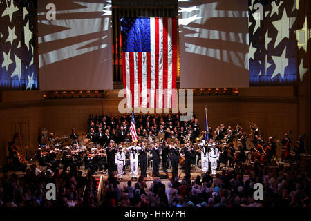 060613-N-8110K-066 Boston (June 13, 2006) - The USS Constitution color guard team presents colors as the Navy Band Northeast Marching Band joins the world renowned 'Boston Pops' performing 'Stars and Stripes' for the grand finale of 'America, Program of Patriotic Songs' at Symphony Hall in Boston. The evening's performance included a pre-concert by the Northeast Navy Show Band. Thousands were on hand for an evening of patriotic music marking the grand finale of Boston Navy Week. Twenty-four such weeks are planned this year in cities throughout the U.S., arranged by the Navy Office of Community Stock Photo