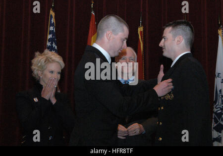 110128-N-3303D-001 NAVAL AIR STATION WHITING FIELD, Fla. (Jan. 28, 2011) Sen. John McCain and his wife, Cindy, watch as their son, Jimmy McCain, pins aviatorÕs wings on his brother, Ensign John S. McCain, during a ceremony at Naval Air Station Whiting Field. Ensign John S. McCain was among 16 helicopter flight school graduates. (U.S. Navy photo by Lt. j.g. Megan Dooner/Released) US Navy 110128-N-3303D-001 Sen. John McCain and his wife, Cindy, watch as their son, Jimmy McCain, pins aviator's wings on his brother, Ensign John Stock Photo