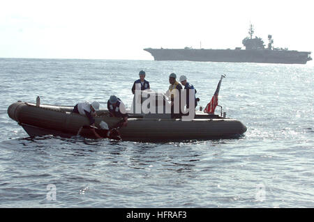 061020-N-1332Y-249 Pacific Ocean (Oct. 20, 2006) - USS Kitty Hawk (CV 63) Sailors pull the training dummy 'Oscar' into the boat after Aviation Boatswain's Mate 3rd Class Joseph Serrano recovered it from the water in a search and rescue (SAR) training exercise. Search and rescue training is performed throughout the year to allow SAR swimmers the chance to practice various techniques. The training also provides new deck department Sailors with a chance to practice small-boat operations. U.S. Navy photo by Mass Communication Specialist Seaman Adam York (RELEASED) US Navy 061020-N-1332Y-249 USS Ki