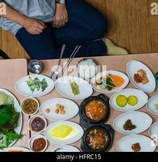 Lots of small Korean dishes served at a restaurant in Gyeongju South Korea. Stock Photo
