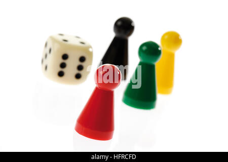 Game pieces and die Stock Photo