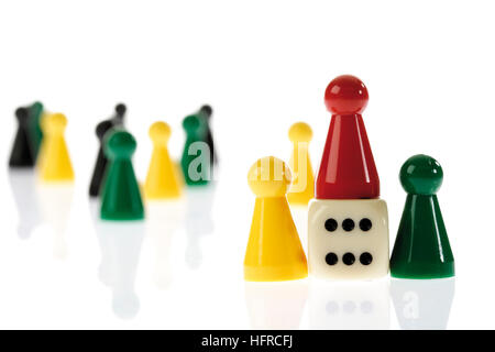 Game pieces and die Stock Photo