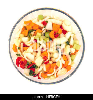 Bowl of fresh raw vegetables for stock, broth or vegetable soup overhead view on a white background Stock Photo