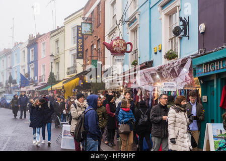 People shopping on a Friday market day in Portobello Road, London, England. December 2016 Stock Photo