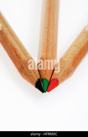 Three pencil crayons (colouring pencils)
