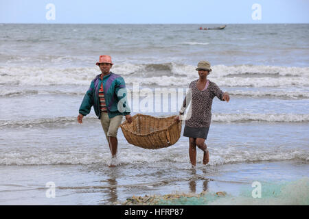 MAROANTSETRA, MADAGASCAR OCTOBER 19.2016 Native fishermen fishing on sea, using traditional technique pulling net from boat. Life of indigenous people Stock Photo