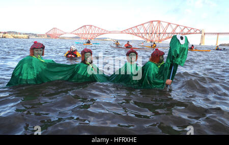 Swimmers take part in the Loony Dook New Year's Day dip in the Firth of Forth at South Queensferry, as part of Edinburgh's Hogmanay celebrations. Stock Photo