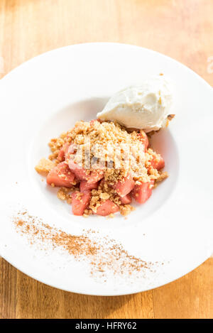 apple crumble with Icecream and cinnamon powder Stock Photo