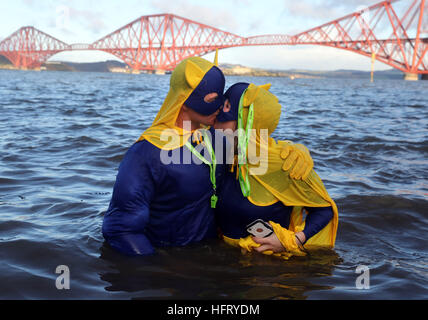 Swimmers take part in the Loony Dook New Year's Day dip in the Firth of Forth at South Queensferry, as part of Edinburgh's Hogmanay celebrations. Stock Photo