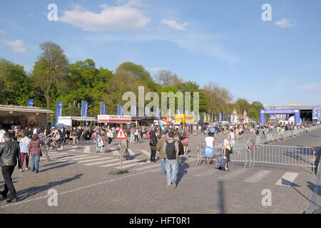 BRUSSELS, BELGIUM-MAY 5, 2013: Tourists on excursion on Place de Palais in Brussels during annual Day of Iris - Fete de l'Iris in Brussels. Stock Photo