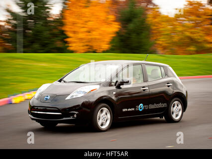 Drivers test drive the 100% electric Nissan LEAF as the mass produced EV makes it's debut in North America. Stock Photo