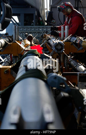 061113-N-8591H-107 Pacific Ocean (Nov. 13, 2006) - Aviation Ordnanceman 1st Class Ronnie Caudle, of Clarksville, Tenn., inspects electric components on an AIM-9X sidewinder missile on the flight deck of USS Kitty Hawk (CV 63). The Kitty Hawk Carrier Strike Group along with the Japanese Maritime Self-Defense Force (JMSDF) is currently participating in exercise ANNUALEX. The exercise is designed to improve both forces' capabilities in the defense of Japan. U.S. Navy photo by Mass Communication Specialist 3rd Class Jarod Hodge (RELEASED) US Navy 061113-N-8591H-107 Aviation Ordnanceman 1st Class R Stock Photo