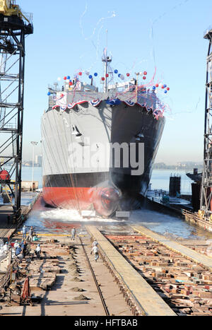 061206-N-9195K-039 San Diego (Dec. 06, 2006) - Military Sealift Command (MSC) advanced auxiliary dry cargo/ammunition ship USNS Alan Shepard (T-AKE 3) slides backwards into San Diego Bay during a christening ceremony held at the National Steel and Shipbuilding Company (NASSCO). The Shepard is the third Lewis and Clark class supply ship to be launched and is scheduled to join the fleet next summer. U.S. Navy photo by Mass Communication Specialist 3rd Class Patrick M. Kearney (RELEASED) US Navy 061206-N-9195K-039 Military Sealift Command (MSC) advanced auxiliary dry cargo-ammunition ship USNS Al Stock Photo