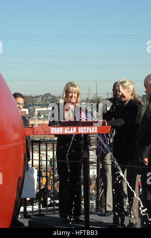 061206-N-9869B-038 San Diego (Dec. 6, 2006) - Ship's sponsor and oldest daughter of Rear Adm. Alan B Shepard, Laura Shepard-Churchley performs one of the Navy's longest traditions by breaking a bottle of champagne over the bow of the Military Sealift Command (MSC) advanced auxiliary dry cargo/ammunition ship USNS Alan B. Shepard (T-AKE 3) during a christening ceremony held at the National Steel and Shipbuilding Company (NASSCO). U.S. Navy photo by Mass Communication Specialist 2nd Class Alexis R. Brown (RELEASED) US Navy 061206-N-9869B-038 Ship's sponsor and oldest daughter of Rear Adm. Alan B Stock Photo