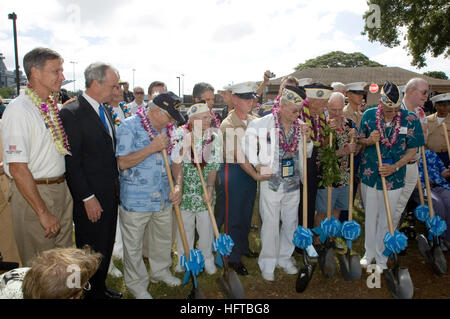 061207-N-9076B-170 Pearl Harbor, Hawaii (Dec. 7, 2006) Ð Fifteen USS Oklahoma survivors along with Secretary of the Department of the Interior, The Honorable Dirk Kempthorne and Governor of Oklahoma, The Honorable Brad Henry broke ground for a USS Oklahoma Memorial, which will be built next to the USS Missouri Museum on Ford Island. More than 1,500 Pearl Harbor survivors, their families and friends from around the nation along with 2,000 distinguished guests and the general public took part in this annual observance. U.S. Navy photo by Chief Mass Communication Specialist Don Bray (RELEASED) US Stock Photo