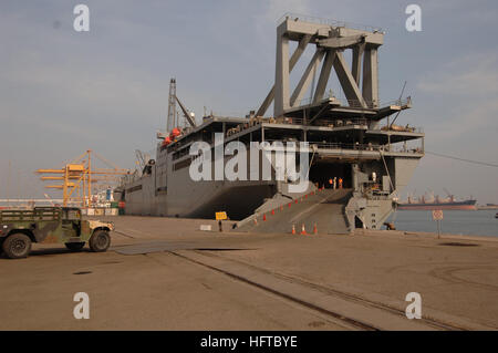 061215-N-5758H-002 Kuwait (Dec. 15, 2006) - After passing a customs inspection, an Army M114 Hummer is parked in front of the Military Sealift Command roll-on/roll-off ship USNS Shughart (T-AKR 295) before Navy cargo handlers with NAVELSG Port Group Echo loads it aboard in Kuwait. NAVELSG Port Group Echo was mobilized, trained, equipped and deployed in support of the global war on terrorism. U.S. Navy photo by Mass Communication Specialist Seaman Kenneth R. Hendrix (RELEASED) US Navy 061215-N-5758H-002 After passing a customs inspection, an Army M114 Hummer is parked in front of the Military S Stock Photo