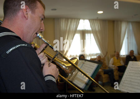 070204-N-2746V-066 Hong Kong, (Feb. 4. 2007) - Musician 2nd Class Matt Anderson plays the trombone as part of the 7th Fleet Band's 'Shonan Brass' during a performance at China Coast Community. The members of the brass quintet took time to share stories with the people of China Coast Community following the 45-minute long performance. Command ship USS Blue Ridge (LCC 19) and the embarked 7th Fleet staff arrived on the island February 3, for a regularly scheduled port visit. U.S. Navy photo by Mass Communication Specialist 2nd Class Adam Vernon (RELEASED) US Navy 070204-N-2746V-066 Musician 2nd  Stock Photo