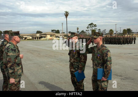 070209-N-7365L-006 PORT HUENEME, Calif. (Feb. 9, 2007) - From left to right, Petty Officer 3rd Class Curtis Cox and Petty Officer 2nd Class Lucas Gallagher salute Rear Adm. Robert Phillips after receiving their Purple Heart awards. U.S. Navy photo by Mass Communication Specialist 2nd Class Ian P. Lundy (RELEASED) US Navy 070209-N-7365L-006 Construction Machanic 3rd Class Curtis Cox and Construction Electrician 2nd Class Lucas Gallagher, both assigned to Naval Mobile Construction Battalion (NMCB) 40 salute Commander. 1st Naval Construct Stock Photo