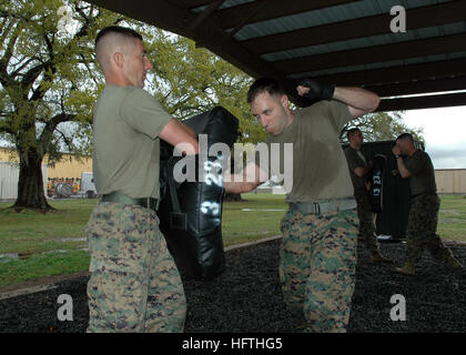 070315-N-7427G-003  NEW ORLEANS (March 15, 2007) - Two Marines spar during a green belt martial arts class hosted by the 3rd Marine Expeditionary Unit, 23rd Battalion. This course certifies the attendees as instructors in disciplined forms of unarmed combat.  U.S. Navy photo by Mass Communications Specialist 1st Class Shawn Graham (RELEASED) US Navy 070315-N-7427G-003 Two Marines spar during a green belt martial arts class hosted by the 3rd Marine Expeditionary Unit, 23rd Battalion Stock Photo