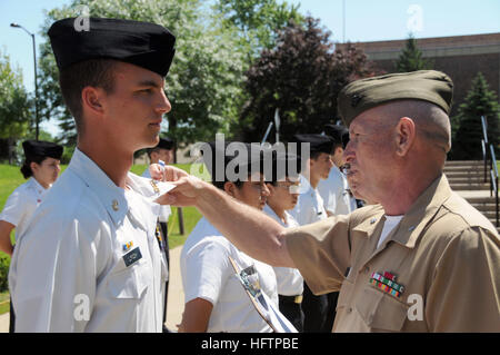 080628-N-8848T-355 NAVAL STATION GREAT LAKES, Ill. (June 28, 2008) Retired Marine Corps Lt. Col. Mike Stewart inspects Navy Junior Reserve Officers Training Corps (JROTC) cadet Ensign James Lynch from Hamilton High School, Hamilton, Ohio. Stewart and Lynch are part of a Leadership Academy at Great Lakes for more than 150 cadets. The goal of the annual academy, hosted by the Navy JROTCÕs Area 3, is to make better leaders by building confidence, improving communication skills and working as a team. U.S. Navy photo by Scott A. Thornbloom, Naval Service Training Command Public Affairs Office (Rele Stock Photo