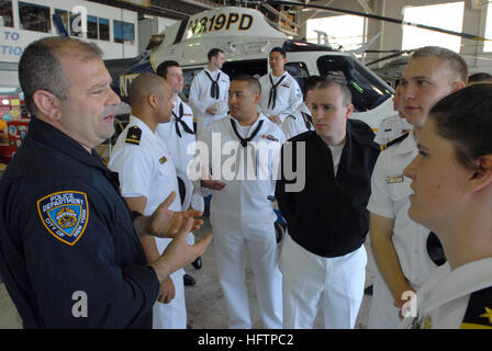 070525-N-3235P-048 NEW YORK (May 25, 2007) - Detective Glenn A. Hoffmann, a helicopter pilot assigned to New York Police Department Aviation Unit, Floyd Bennett Field, Brooklyn, New York, gives a tour of their facility to Sailors from USS Wasp (LHA 1), USS Winston S. Churchill (DDG 81), USS Oscar Austin (DDG 79) and USS San Jacinto (CG 56). Sailors and Marines are visiting New York City in support of Fleet Week 2007. The 20th annual Fleet Week New York is the opportunity for New Yorkers to meet Sailors, Marines and Coast Guardsmen and thank them for their service. Fleet Week honors the service Stock Photo