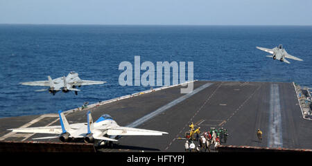 060213-N-0685C-014 February 13, 2006 Aboard USS Theodore Roosevelt (CVN 71) Two F-14D Tomcats make departures aboard USS Theodore Roosevelt (CVN 71). The nuclear powered aircraft carrier is currently underway on a regularly scheduled deployment supporting maritime security operations. U.S. Navy photo by Photographer's Mate Airman Javier Capella US Navy 060213-N-0685C-014 Two F-14D Tomcats launch from the flight deck of the Nimitz-class aircraft carrier USS Theodore Roosevelt (CVN 71) Stock Photo