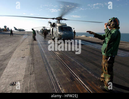071105-N-8132M-131  PERSIAN GULF (Nov. 05, 2007) - Aviation Electronics Technician 3rd Class Melissa Baker landing signal enlisted (LSE) prepares to launch an HH-60H Seahawk, attached to the 'Dragonslayers' of Helicopter Antisubmarine Squadron (HS) 11, off the flight deck of the nuclear-powered aircraft carrier USS Enterprise (CVN-65). Enterprise and embarked Carrier Air Wing (CVW) 1, are underway on a scheduled six-month deployment in support of Operation Iraqi Freedom and Maritime Operations. U.S. Navy photo by Mass Communication Specialist Seaman Kiona M. Mckissack (RELEASED) US Navy 071105 Stock Photo
