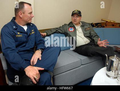 080127-N-7981E-150 PACIFIC OCEAN (Jan. 27, 2008) Secretary of the Navy (SECNAV) The Honorable Dr. Donald Winter speaks with Cmdr. Michael Sparks, commanding officer of the Arleigh Burke-class guided-missile destroyer USS Momsen (DDG 92) inside the ship's in-port cabin. Winter visited Momsen with members of the press to observe steps being taken to mitigate the impact of sonar on marine mammals. Momsen and other members of the Abraham Lincoln Strike Group are participating in a joint task force exercise off the coast of Southern California. U.S. Navy photo by Mass Communication Specialist 2nd C Stock Photo