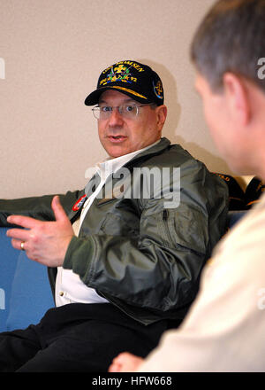 080127-N-7981E-279 PACIFIC OCEAN (Jan. 27, 2008) Secretary of the Navy (SECNAV) The Honorable Dr. Donald Winter speaks with Capt. James Loeblein, commodore of Destroyer Squadron (DESRON) 9 in the in-port cabin aboard the Arleigh Burke-class guided-missile destroyer USS Momsen (DDG 92). Winter visited Momsen with members of the press to observe steps being taken to mitigate the impact of sonar on marine mammals. Momsen and other members of the Abraham Lincoln Strike Group are participating in a joint task force exercise off the coast of Southern California. U.S. Navy photo by Mass Communication Stock Photo