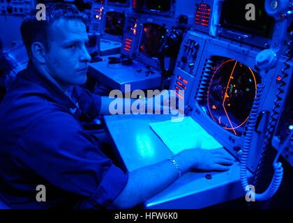 050609-N-8604L-026 Pacific Ocean (June 9, 2005) - Operations Specialist 2nd Class Lucas Weaver of Three Rivers, Mich., mans the strike control console aboard the conventionally-powered aircraft carrier USS Kitty Hawk (CV 63) during flight operations. Currently under way in the 7th Fleet area of responsibility (AOR), Kitty Hawk demonstrates power projection and sea control as the U.S. Navy's only permanently forward-deployed aircraft carrier, operating from Yokosuka, Japan. U.S. Navy photo by Photographer's Mate Airman Joshua Wayne LeGrand (RELEASED) US Navy 050609-N-8604L-026 Operations Specia Stock Photo