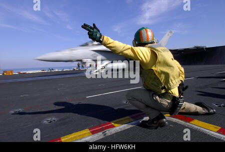 080207-N-0455L-001 PERSIAN GULF (Feb. 7, 2008) Lt. Stephen Weeks, a “Shooter” on the flight deck of the Nimitz-class aircraft carrier USS Harry S. Truman (CVN 75), gives the signal for an F/A-18E Super Hornet to launch off ship. Truman and embarked Carrier Air Wing (CVW) 3 are deployed supporting Operations Iraqi Freedom, Enduring Freedom and maritime security operations. U.S. Navy photo by Mass Communication Specialist Seaman Justin L. Losack (Released) US Navy 080207-N-0455L-001 Lt. Stephen Weeks, a Stock Photo