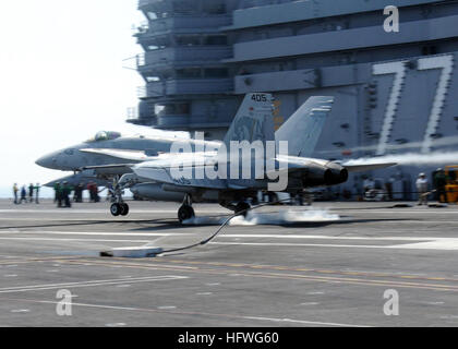 100715-N-5446H-211 ATLANTIC OCEAN (July 15, 2010) An F/A-18 Hornet assigned to the Golden Warriors of Strike Fighter Squadron (VFA) 87 lands aboard the aircraft carrier USS George H.W. Bush (CVN 77). George H.W. Bush is conducting training in the Atlantic Ocean. (U.S. Navy photo by Naval Air Crewman 3rd Class Joshua Horton/Released) US Navy 100715-N-5446H-211 An F-A-18 Hornet lands aboard USS George H.W. Bush (CVN 77) Stock Photo