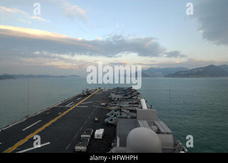 The forward-deployed amphibious assault ship USS Essex arrives in Hong Kong for a scheduled port visit. Essex is the lead ship of the only forward-deployed expeditionary strike group and serves as the flagship for CTF 76, the Navy's only forward-deployed amphibious force commander. USS Essex arrives in Hong Kong for port visit DVIDS131583 Stock Photo