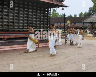 Holy people performing daily worship rituals in Shri Krishna temple, Ambalpuram, Kerala, India Stock Photo