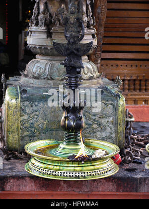 Brass oil lamps, Dharmashastra Temple, Tagari, Kerala, India Stock Photo