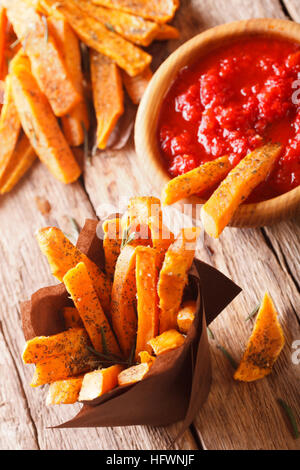 roasted sweet potato fries and ketchup close-up on the table. Vertical, Rustic Stock Photo